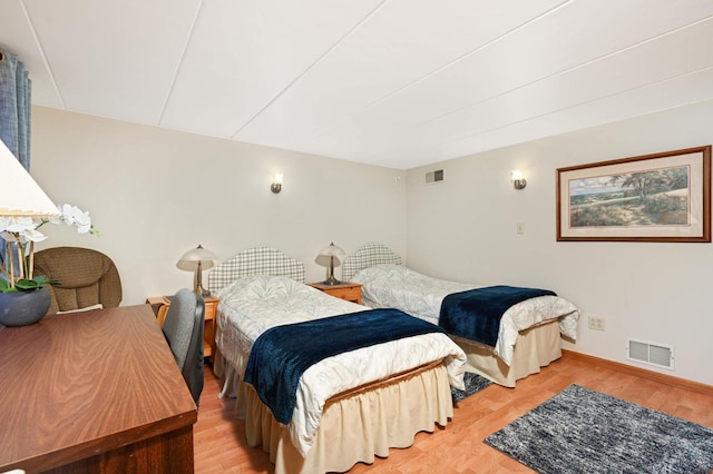 bedroom with light hardwood / wood-style flooring