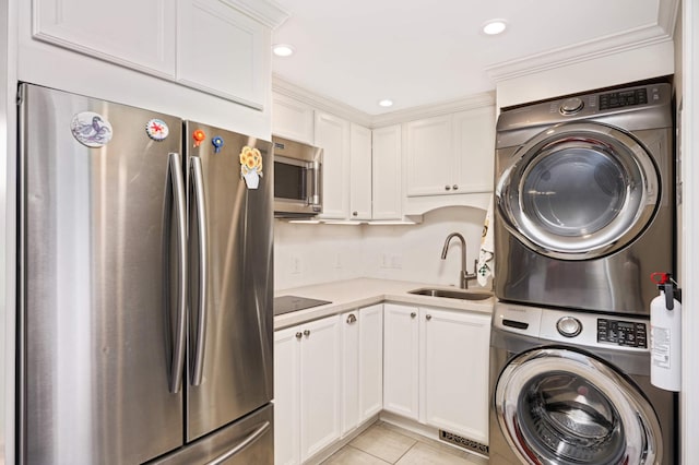 interior space with sink, stacked washing maching and dryer, crown molding, and light tile patterned flooring