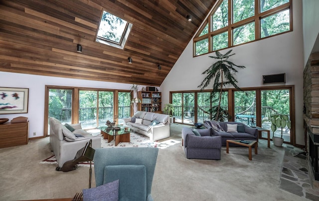 carpeted living room with a high ceiling, a skylight, and wood ceiling