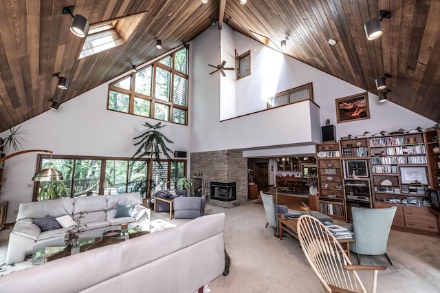 living room featuring high vaulted ceiling, plenty of natural light, and wood ceiling