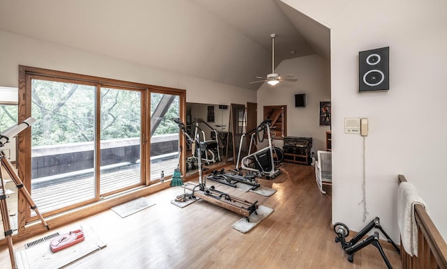 exercise area featuring ceiling fan, hardwood / wood-style floors, and vaulted ceiling