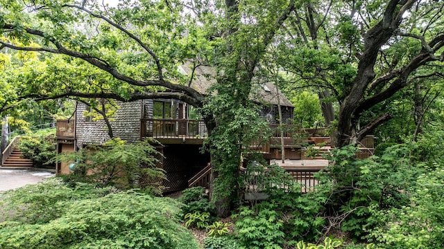 back of house featuring a deck