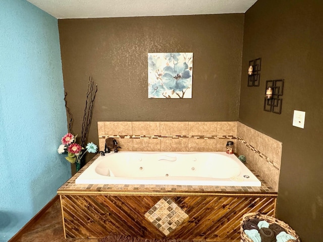 bathroom featuring tiled tub and tile patterned flooring