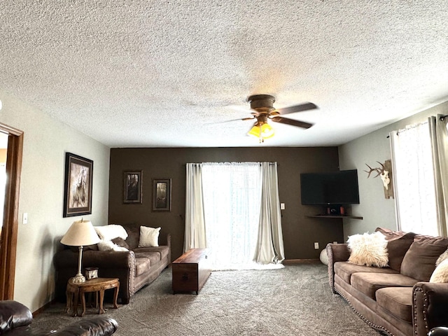 carpeted living room with a textured ceiling and ceiling fan