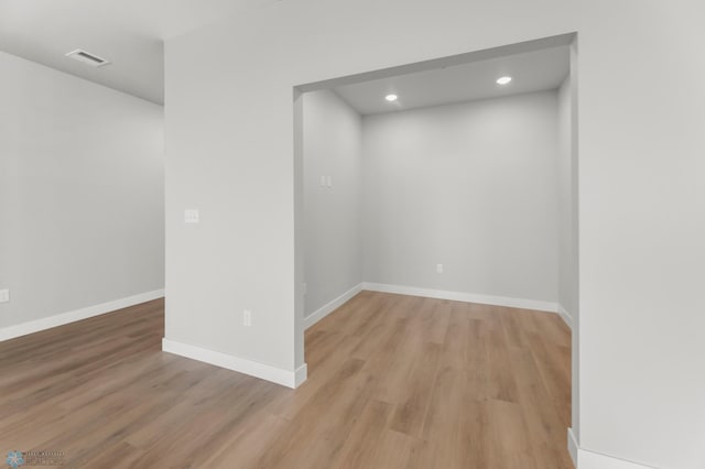 empty room with light hardwood / wood-style floors