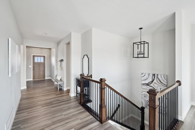 interior space with a chandelier and light hardwood / wood-style flooring