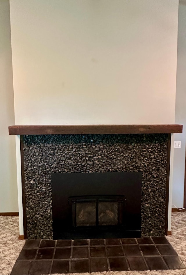 interior details with a tiled fireplace