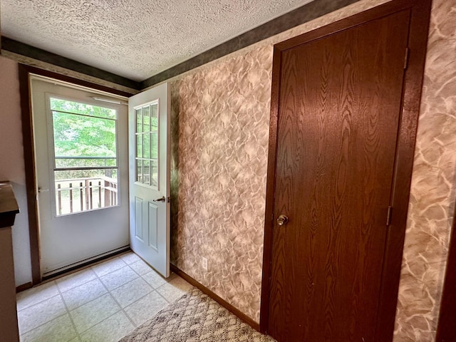 entryway featuring a textured ceiling