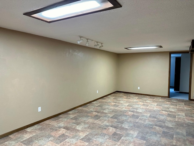 spare room with a textured ceiling