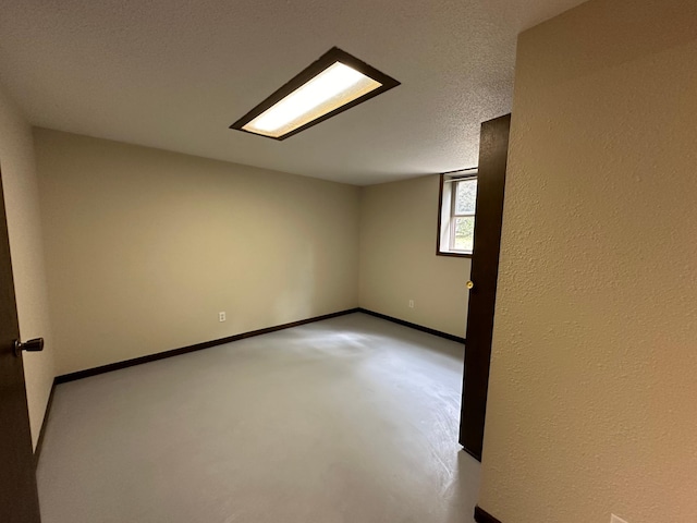 empty room with a textured ceiling