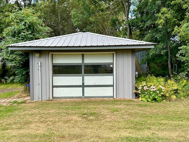 garage with a lawn