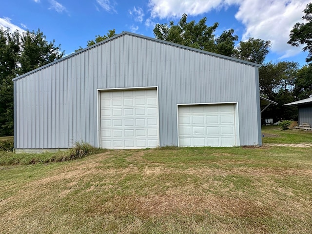 garage featuring a yard