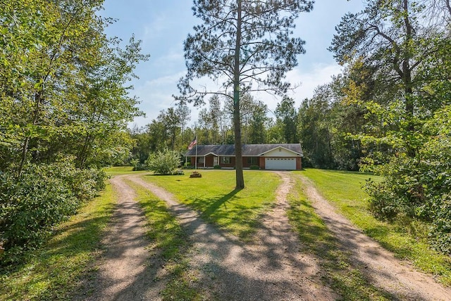 view of front facade featuring a garage and a front lawn