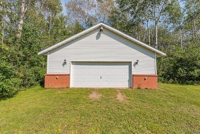 garage featuring a lawn