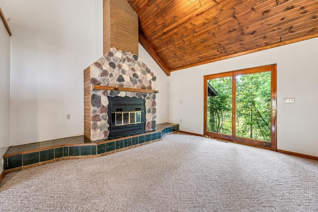 unfurnished living room featuring wood ceiling, high vaulted ceiling, a fireplace, and carpet