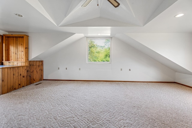 bonus room with lofted ceiling, carpet flooring, and ceiling fan