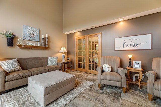 living room with french doors and baseboards