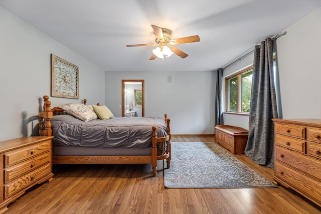 bedroom featuring light wood-type flooring and a ceiling fan