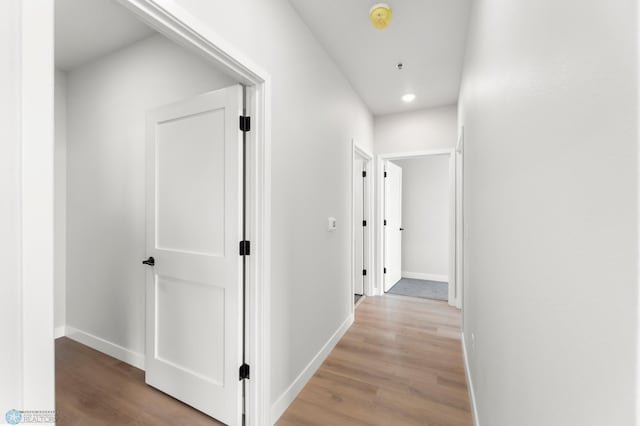 hallway with light wood-type flooring