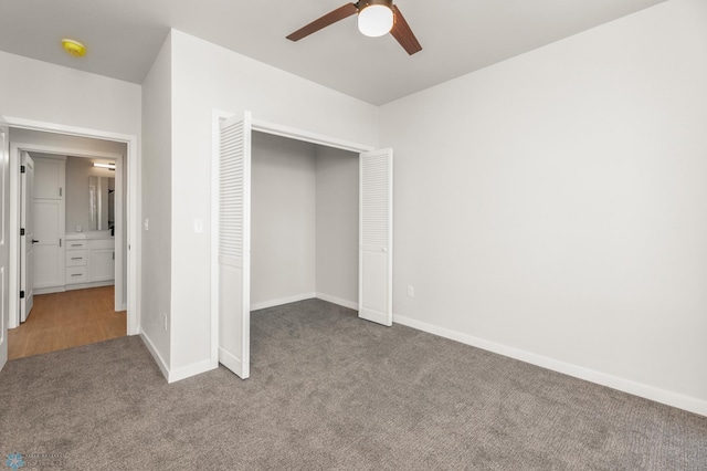 unfurnished bedroom featuring carpet floors, ceiling fan, and a closet