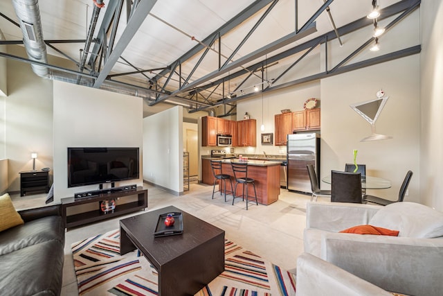 living room with a high ceiling