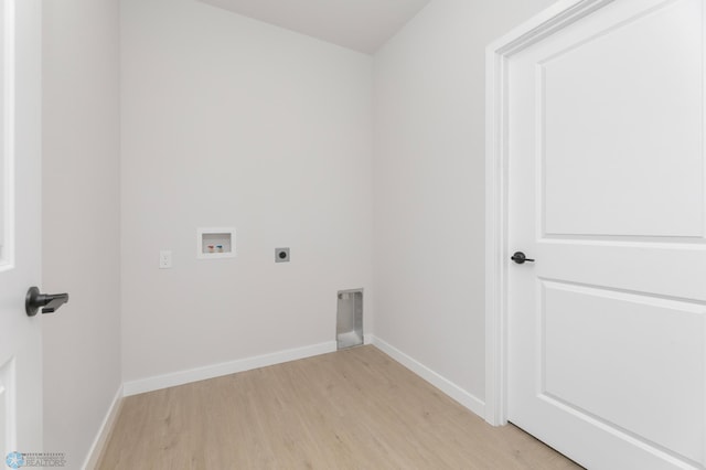 laundry area with electric dryer hookup, light wood-type flooring, baseboards, hookup for a washing machine, and laundry area