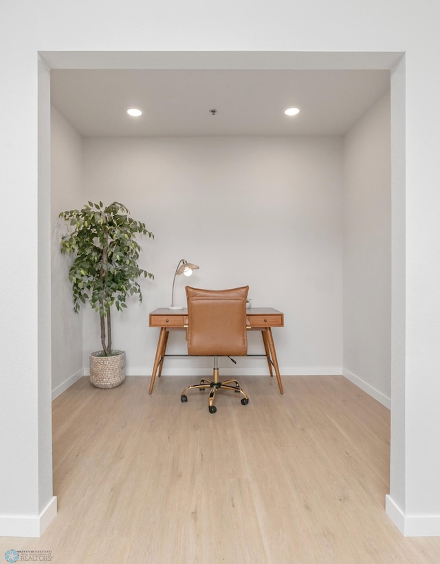 office with recessed lighting, wood finished floors, and baseboards