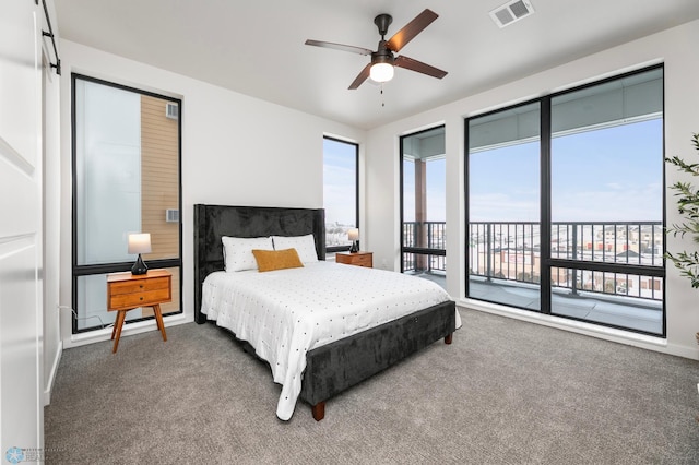 carpeted bedroom with access to exterior, a ceiling fan, visible vents, and baseboards