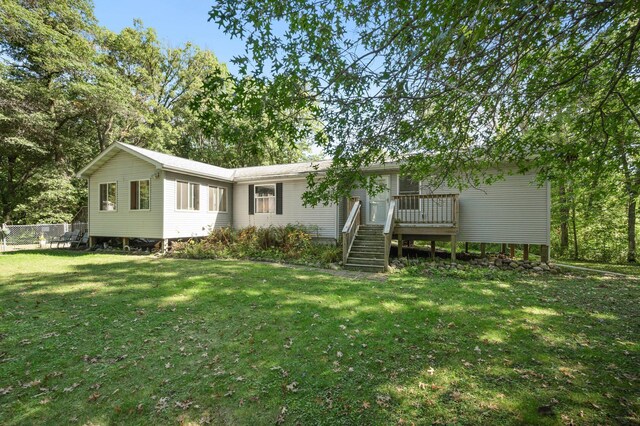 2894 115th Ave, Greenbush Twp, MN 55371 - back of property featuring a lawn, a deck, and stairs