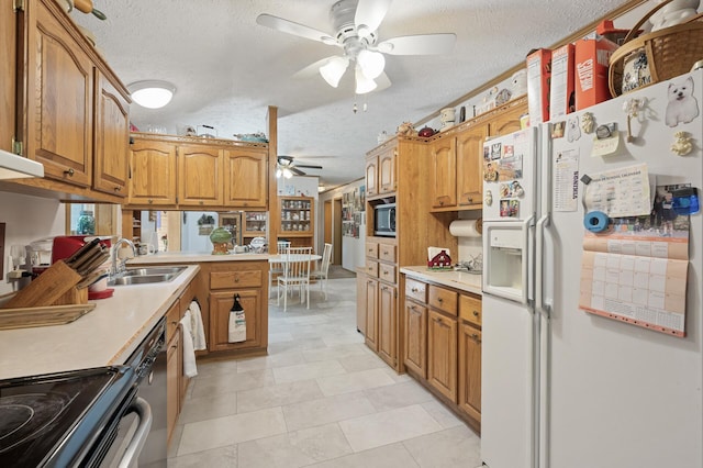 2894 115th Ave, Greenbush Twp, MN 55371 - kitchen with white fridge with ice dispenser, ceiling fan, a textured ceiling, a sink, and built in microwave
