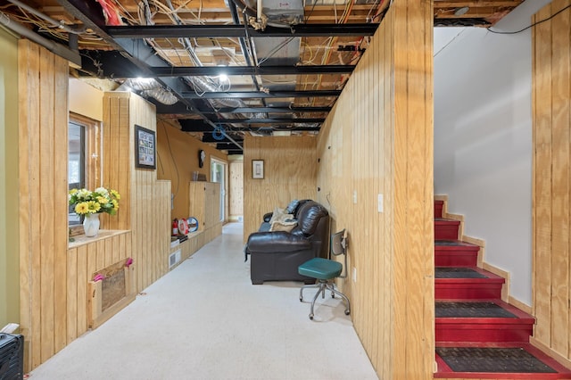 2894 115th Ave, Greenbush Twp, MN 55371 - basement featuring wooden walls, stairway, and plenty of natural light
