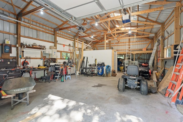 2894 115th Ave, Greenbush Twp, MN 55371 - garage with a garage door opener, a workshop area, and metal wall