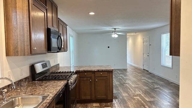 kitchen with ceiling fan, sink, kitchen peninsula, black appliances, and dark hardwood / wood-style floors