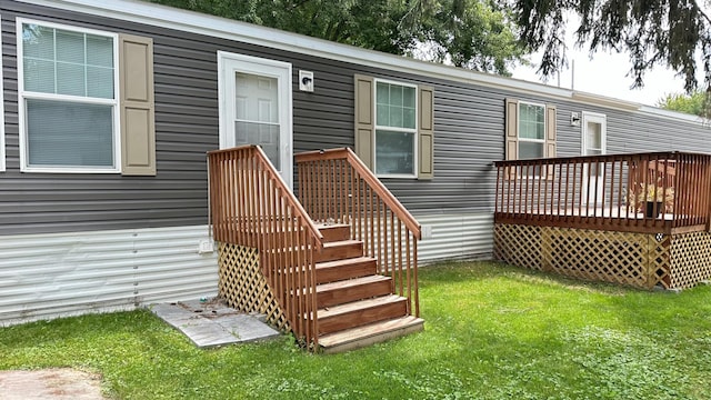 exterior space featuring a lawn and a deck