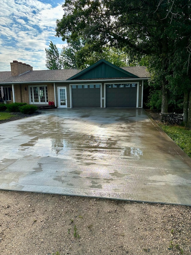 single story home with a garage