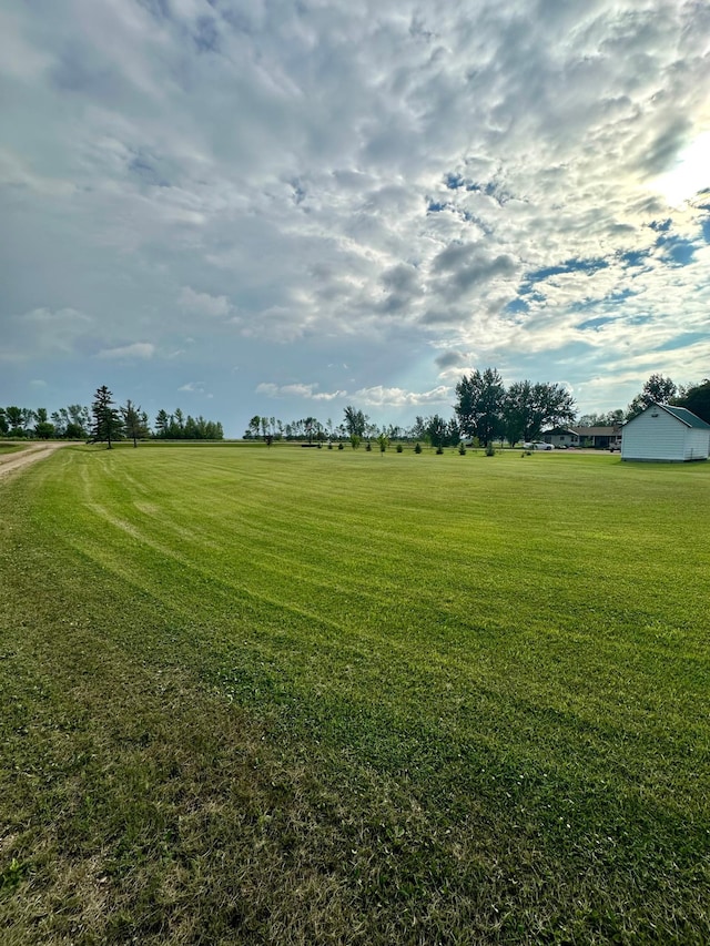 view of yard with a rural view