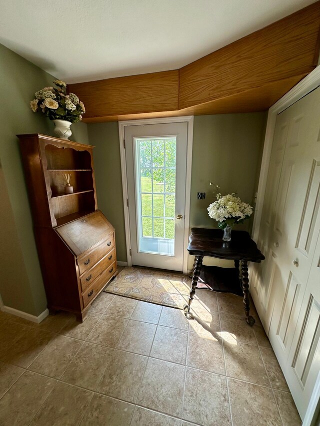 doorway to outside featuring light tile patterned floors