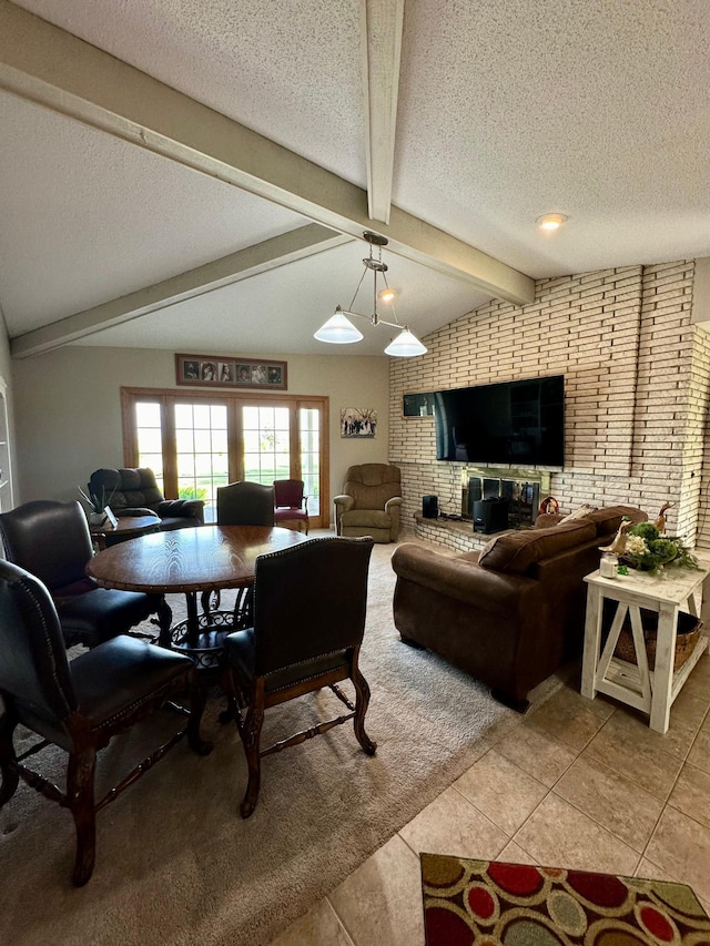 living room featuring light tile patterned floors, vaulted ceiling with beams, brick wall, and a textured ceiling