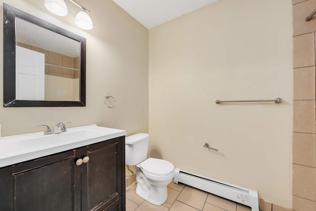 bathroom with baseboard heating, vanity, toilet, and tile patterned floors