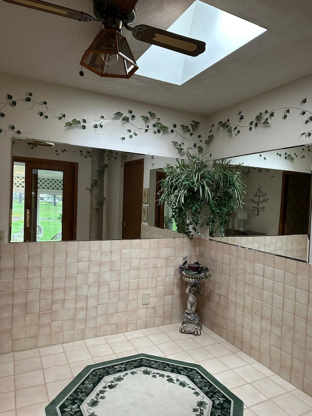 detailed view of ceiling fan and a skylight