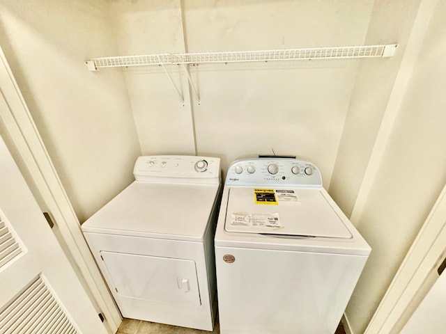 washroom with laundry area and independent washer and dryer