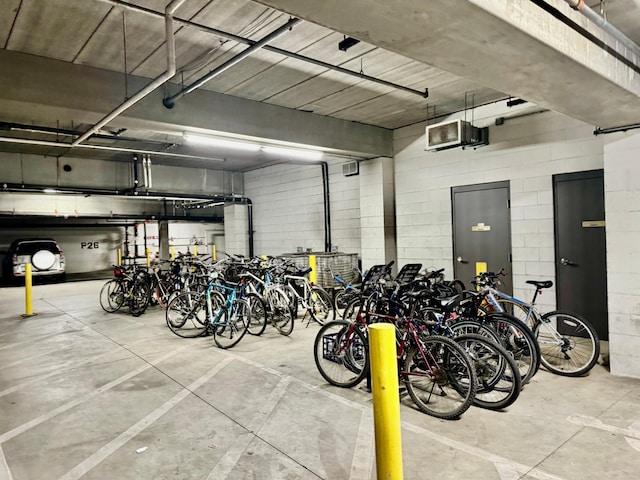 garage with concrete block wall and bike storage