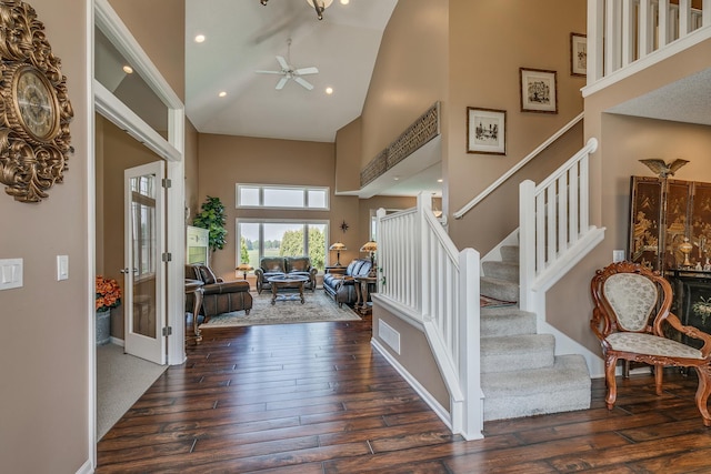 entrance foyer featuring ceiling fan, dark hardwood / wood-style flooring, and high vaulted ceiling