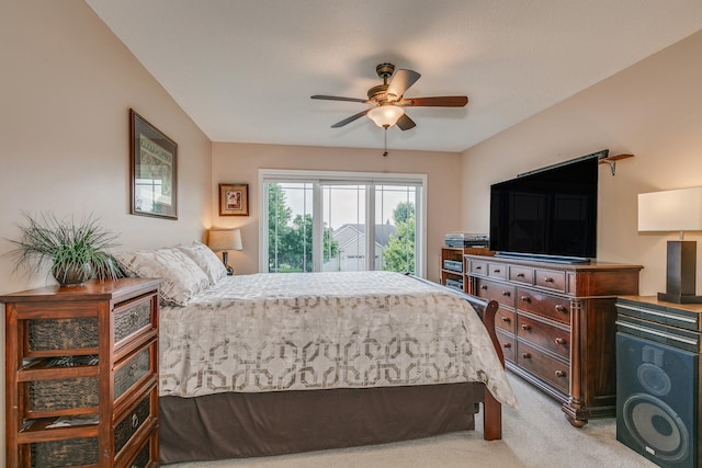 bedroom featuring light carpet, ceiling fan, and access to exterior