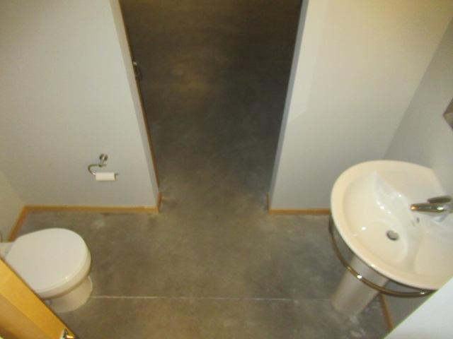 bathroom with sink, toilet, and tile patterned floors