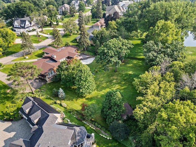 birds eye view of property with a residential view