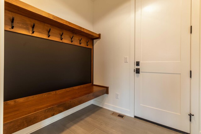 mudroom with light hardwood / wood-style flooring