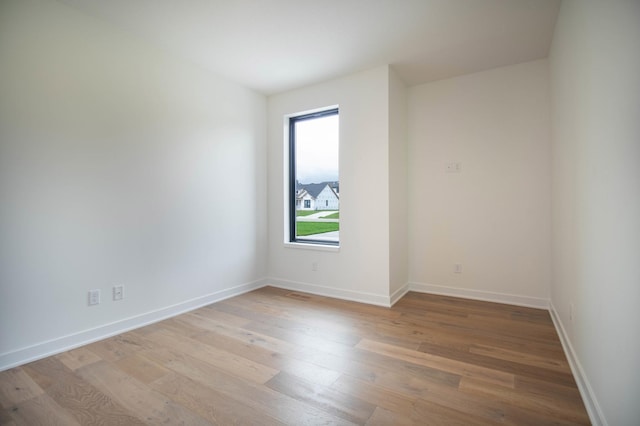 unfurnished room featuring light hardwood / wood-style flooring