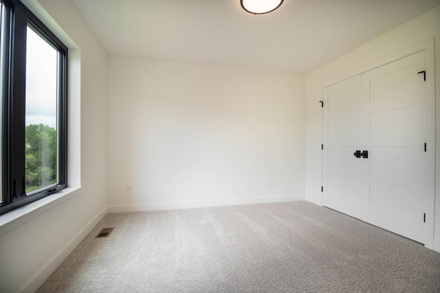 empty room featuring carpet floors