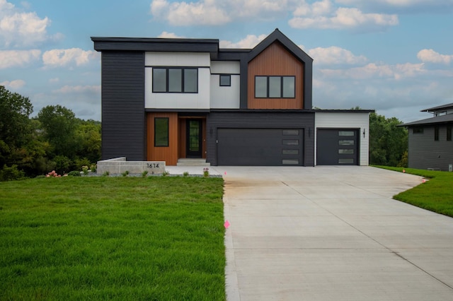 contemporary house with a garage and a front yard